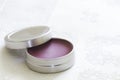 Purple lip balm with beeswax Royalty Free Stock Photo