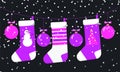 Purple magenta white Christmas socks and balls hanging on garland with snowfall. Horizontal design for New Year decoration card