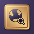 Purple Magnifying glass with globe icon isolated on purple background. Analyzing the world. Global search sign. Gold Royalty Free Stock Photo