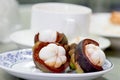 Purple mangosteen in plate