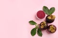 Purple mangosteen powder and fruits on pink, flat lay. Space for text