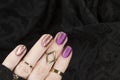 Purple matte manicure with gold abstraction. Holiday rich nail gel design