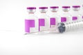 Purple medicine injection vial and disposable injection syringe Royalty Free Stock Photo