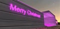 A purple Merry Christmas lettering on the aluminum wall of an advanced private estate near the entrance to the room where they are