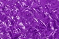 Purple metallic foil shiny texture, wrinkled wrapping paper for background and design art work Royalty Free Stock Photo