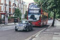 The purple mini cooper and the Routemaster on Abbey Road in the City of Westminster, London