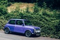 Purple Mini parked on a side of the road in London