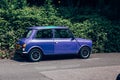 Purple Mini parked on a side of the road in London