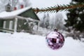 Purple mirror colorful christmas ball on fir tree branch with rural background Royalty Free Stock Photo