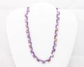 Purple neclace made with three different sized beads Royalty Free Stock Photo