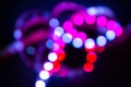 Purple Neon bokeh lights on black. Abstract blurred background