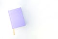 Purple notebook or book on the bright background Royalty Free Stock Photo
