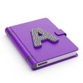 Purple Notebook with a Textured Letter A on the Cover and a Strap Closure journal diary Royalty Free Stock Photo