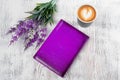 A purple notepad cup of coffee flowers Royalty Free Stock Photo