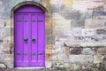 Purple old wooden door rustic ancient house entrance in Culross