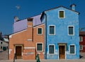 Purple, orange and blue houses in Burano, Italy