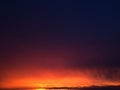 Purple and Orange Sunset above Niihau Island in Pacific Ocean - Vie from Port Allen on Kauai Island in Hawaii. Royalty Free Stock Photo