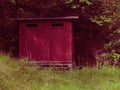 Photo of Purple outdoor restroom Royalty Free Stock Photo