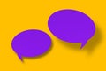 Purple paper cut speech balloon shape against a yellow background