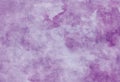 Purple paper parchment background with distressed vintage stains and ink spatter and white faded grainy watercolor stains, elegant