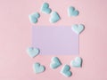 Purple pastel card and hearts on pink textured background Royalty Free Stock Photo