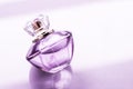 Purple perfume bottle on glossy background, sweet floral scent, glamour fragrance and eau de parfum as holiday gift and luxury Royalty Free Stock Photo