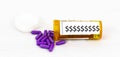 Purple pills spilling our of container with dollar signs on it Royalty Free Stock Photo