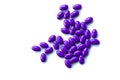 Purple pills on white background isolated Royalty Free Stock Photo