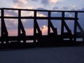 Purple/Pink Sunrise through the pier