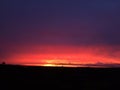 Purple and Pink Sunset above Niihau Island in Pacific Ocean - Vie from Port Allen on Kauai Island in Hawaii. Royalty Free Stock Photo