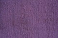 Purple plaster wall. Uneven texture of putty on the wall with copy space Royalty Free Stock Photo