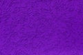 Purple plastered wall. Imitation of the bark beetle surface. Plastered wall using a granular decorative mixture Royalty Free Stock Photo
