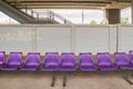 Purple plastic benches in railway station