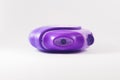 Purple powder asthma inhaler on white