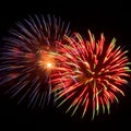 Purple, red, green, and gold fireworks explode during an Independence Day celebration in the United States. Royalty Free Stock Photo