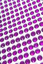 Purple Rhinestone background. Heart shape texture as backdrop isolated white studio photo. Bling rhinestone crystal