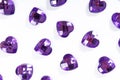 Purple Rhinestone background. Heart shape texture as backdrop isolated white studio photo. Bling rhinestone crystal