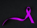 Purple ribbon awareness on black background Royalty Free Stock Photo