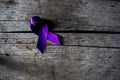 A purple ribbon for the awareness about the unacceptability of the violence against women, Royalty Free Stock Photo