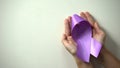 Purple ribbon in lady hands, world Alzheimer disease awareness day, healthcare Royalty Free Stock Photo