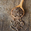 Purple rice seed spoon on wood Royalty Free Stock Photo