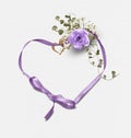 Purple rose bouquet on heart ribbon with bow Royalty Free Stock Photo