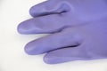 Purple rubber gloves Royalty Free Stock Photo