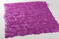 Purple rubber mat for bath with pattern as background, imitation of stones Royalty Free Stock Photo