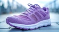 Purple running shoe on urban background. Close-up shot with selective focus Royalty Free Stock Photo