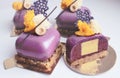 Purple shiny glaze dessert with hazelnut and coral lace crepe decor sliced