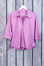 Purple shirt on hanger, flat lay. Royalty Free Stock Photo