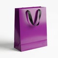 A purple shopping bag with black handles Royalty Free Stock Photo