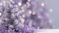 Purple and silver christmas tree with sparkling decorations in festive setting Royalty Free Stock Photo