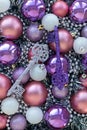 Purple and silver keys on purple and violet Christmas balls. Christmas background. New Year concept Royalty Free Stock Photo